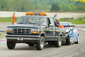 9472195-thruxton-united-kingdom--may-1-2011-recovery-truck-towing-away-wreckage-of-a-chevrolet-d.jpg