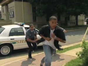blackguyruningfrompolice.jpg